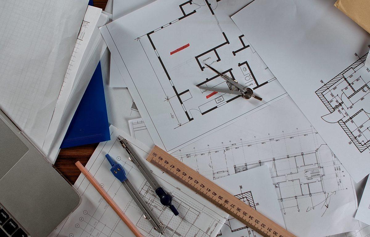 Desk with architectural plans and instruments
